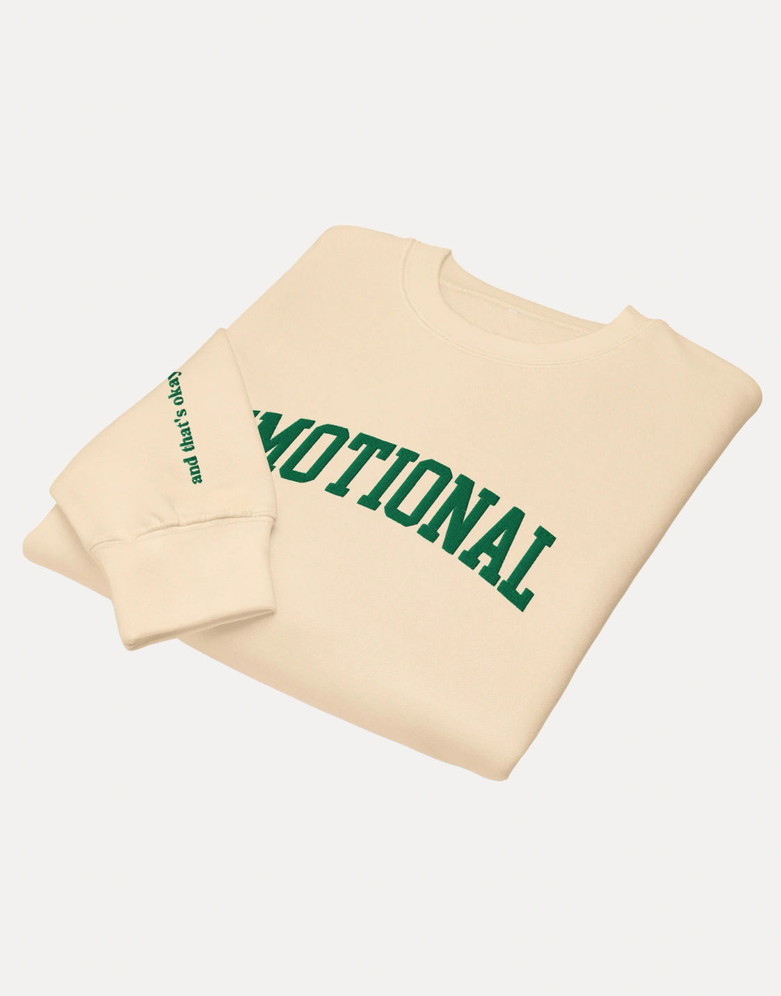 Beige sweatshirt with green text on a white background