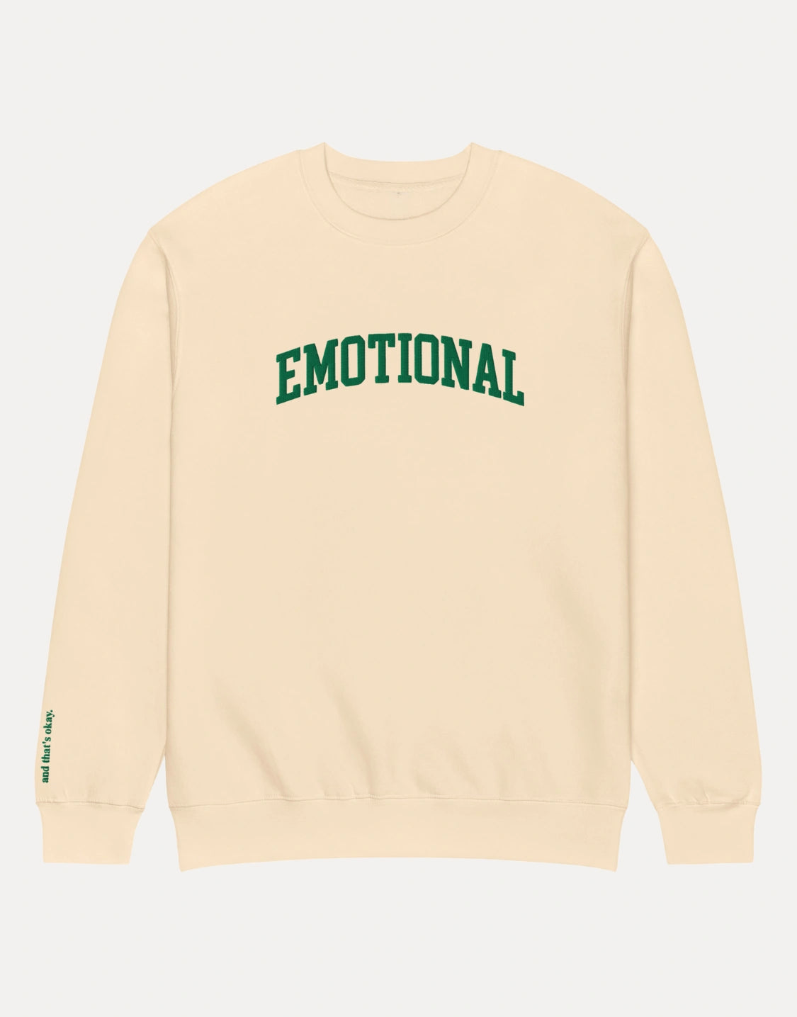 Beige sweatshirt with 'EMOTIONAL' in green text on a white background